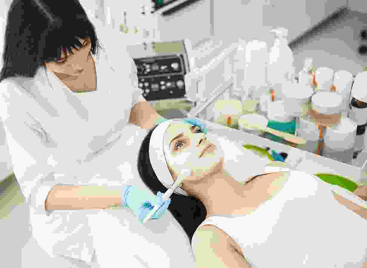 A woman is getting her face painted